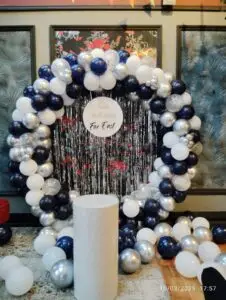 Black and white balloon arch decoration for birthday party.