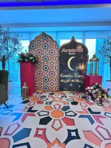 Blue and gold Ramadan Eid decoration with crescent moon and patterned backdrop for festive events in Dubai.
