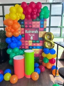Birthday party decoration for 8-year-old child with balloons and themed setup.