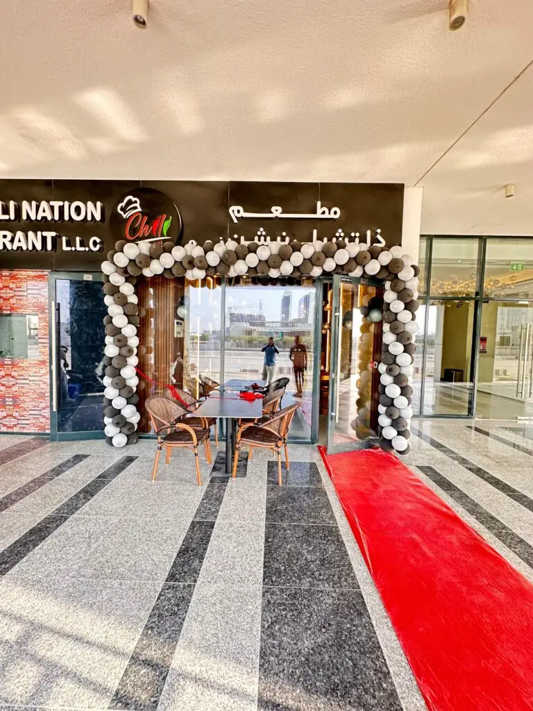 Professional balloon arch decoration designed for corporate events, featuring brand colors and a sleek, elegant arrangement ideal for entrances, product launches, or ceremonies.