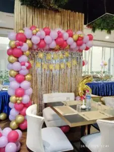 Pink and gold balloon decoration featuring elegant balloon clusters and garlands, perfect for birthdays, baby showers, or bridal celebrations.