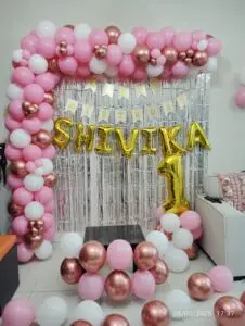 Pink and white balloon decoration featuring soft pastel balloons arranged in garlands or clusters, ideal for baby showers, birthdays, or bridal events.